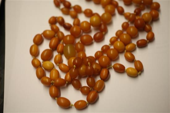 Two single strand graduated amber bead necklaces and one other round bead necklace with paste set clasp, longest 35.5in.